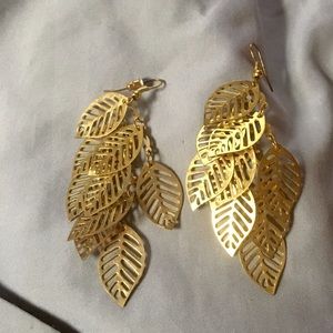 Gold dangling feather earring