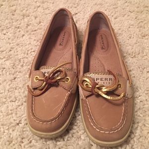 Sperry boat shoes. Has sparkles on the side