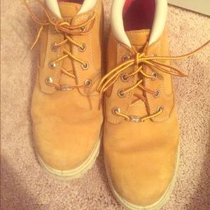 Woman's Timberland boots with white bottoms