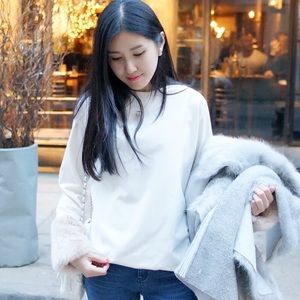 Elegant white top with faux fur sleeves
