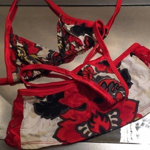 Three piece thong bikini and skirt play set