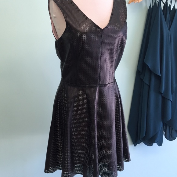 Black faux leather laser cut dress.