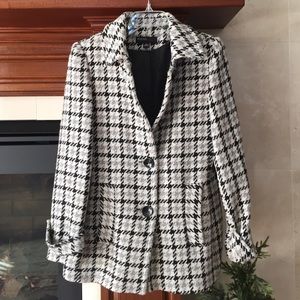 Jason Kole black and white coat