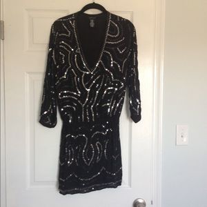 VS Moda International black sequin dress.