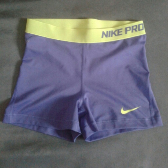 Purplr and lime green nike spandex shorts