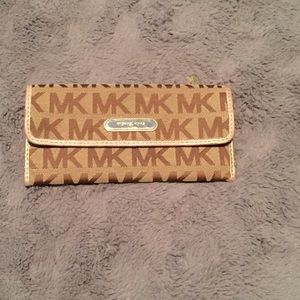 MK tan/gold flap wallet