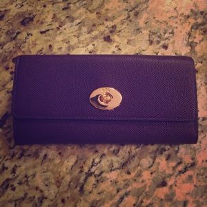 Purple Coach wallet.