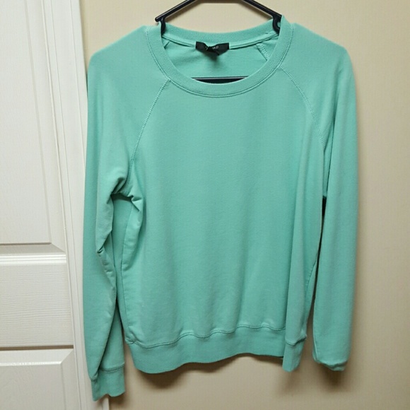 Turquoise sweater. Size medium.