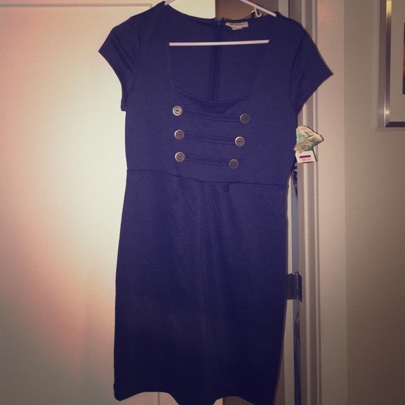 New with tags blue dress with accented buttons.
