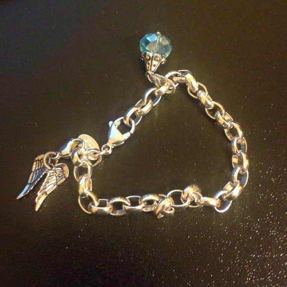 Origami owl bracelet and two charms.,