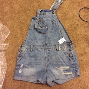 overall shorts.