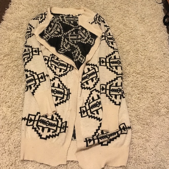 White sweater cardigan with black Aztec designs