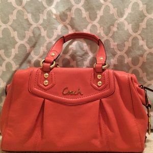 Peach colored coach handbag