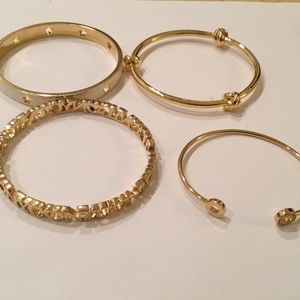 Lot 4 gold tone C Wonder bangles