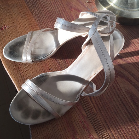 Fancy but worn heeled sandals