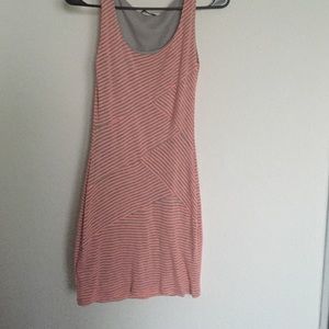 Gray and orange-pinkish with symmetrical dress.