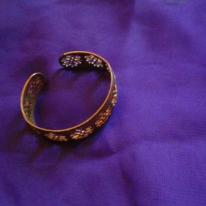 A light copper toned cuff bracelet