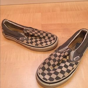 White and gray checker slip on vans