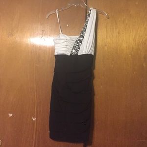 Black and white one sleeved form fitting dress