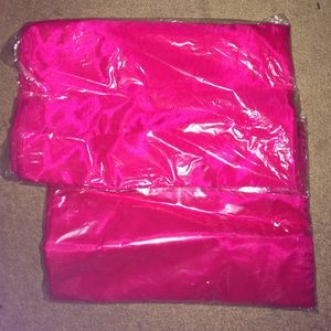 Two panels of Victoria's Secret sheer curtains.