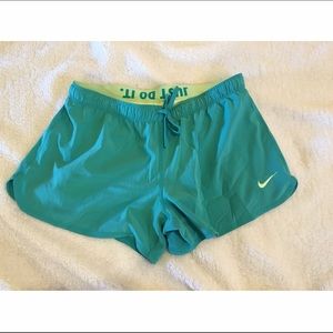 Bright teal Nike shorts