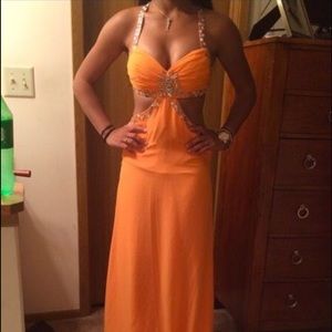 Tangerine beaded cut out prom dress.