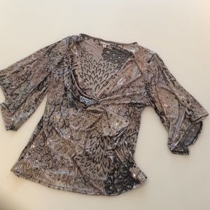 Glittery top with keyhole sleeves