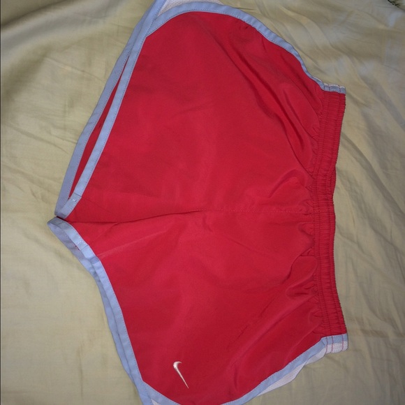 Hot pink nike shorts with light blue trim