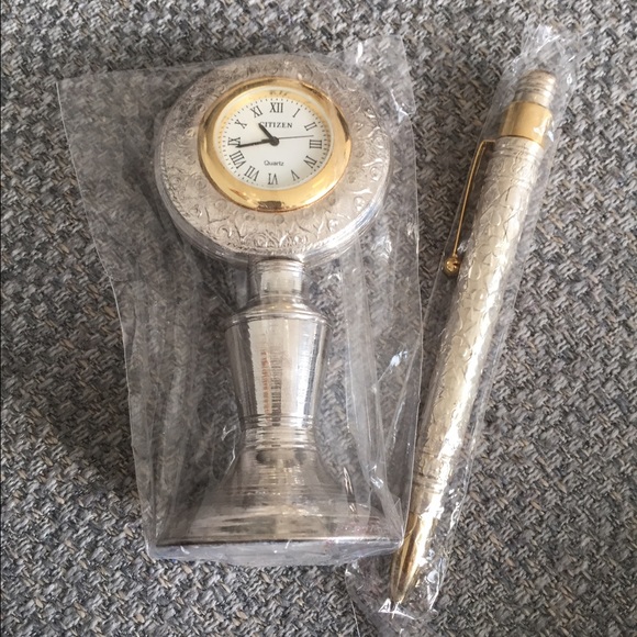 Silver watch and pen