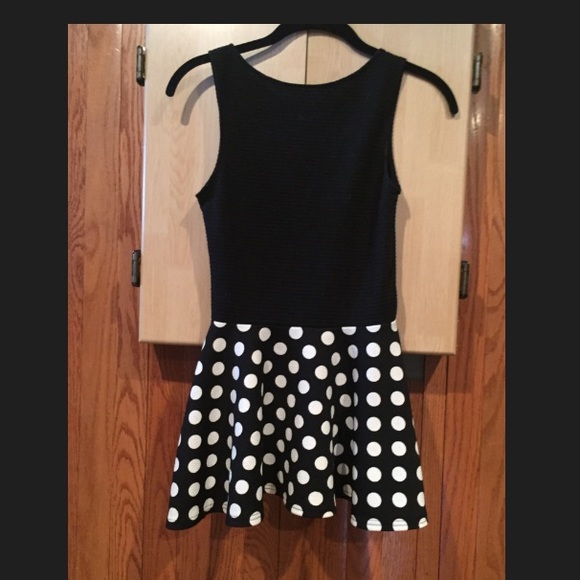 Black and polka dot peplum top