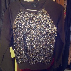 Olive pullover sweater with sequins.