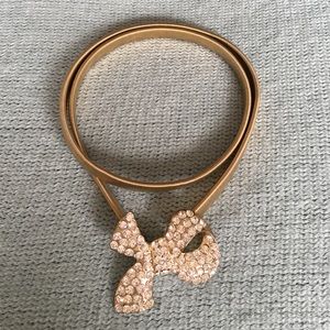 Gold elastic belt with sparkly bow buckle