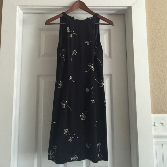 Adorable black dress with white flowers.