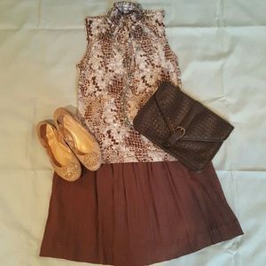 Sleeveless snake print mock neck