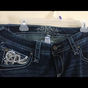 Maurice's jeans bottom a little break down