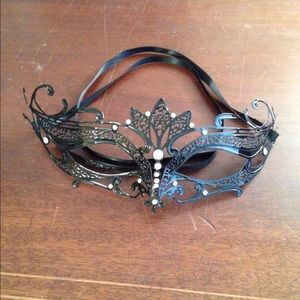 Metal mask with rhinestones.