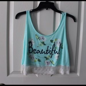 teal tank top that says "beautiful"