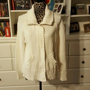 White XL zip up sweater with high neck.