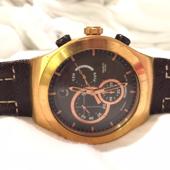 Brown and gold swatch watch