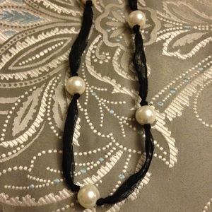 Two long pearl necklaces