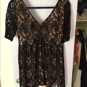 Torrid hi-lo lace top with nude lining.