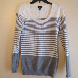 Grey and cream colored sweater