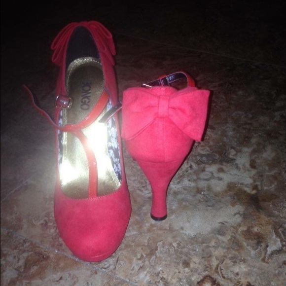 Red heels with a double bow in the back