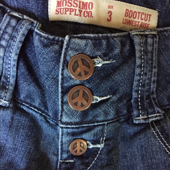 Super cute jeans with peace sign buttons and studs
