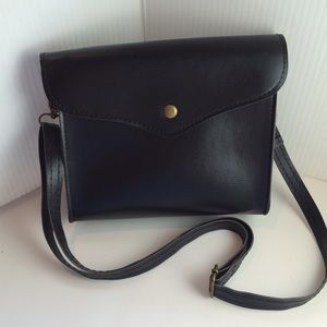 Black leather messenger bag. NWOT 7"x8"x2"