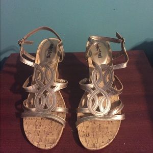Golden wedged heels
