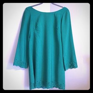 Trendy green dress with detailed cutouts
