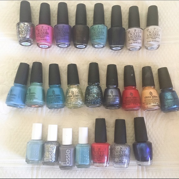 24 bottles of full size nail polish. OPI, Essie