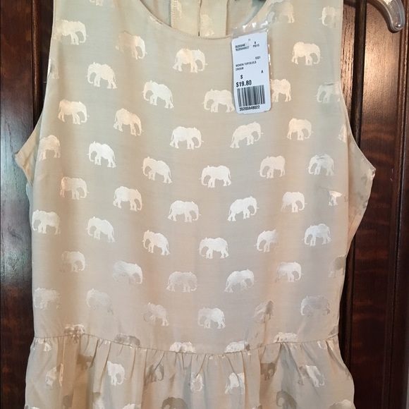 Cream colored blouse.