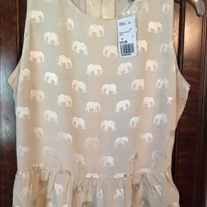 Cream colored blouse.